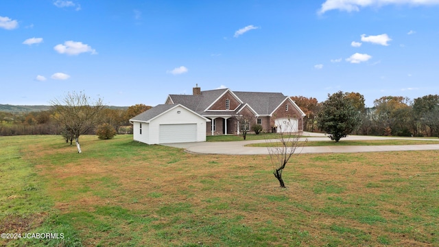 view of front of home featuring a garage and a front yard