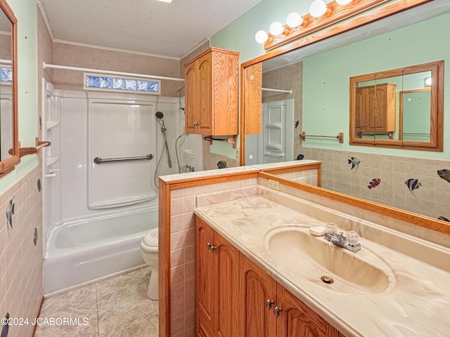 full bathroom featuring vanity, tile patterned flooring, toilet, a textured ceiling, and shower / bathtub combination