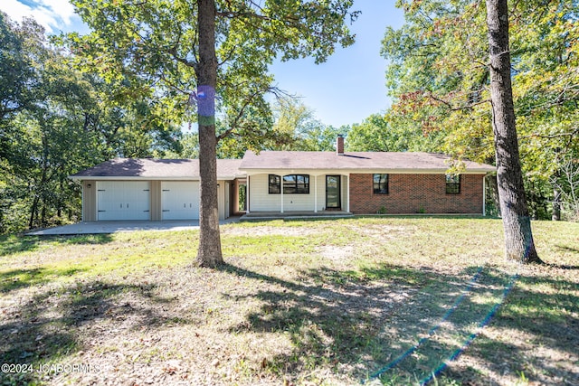 ranch-style house with a porch, a garage, and a front yard