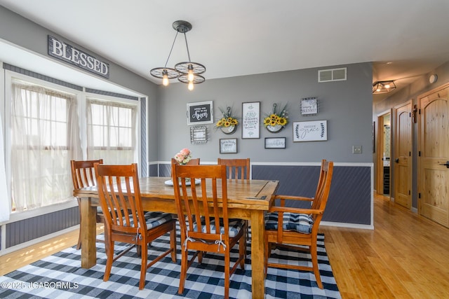 3609 Shamrock Rd, Jefferson City, MO 65101 - dining area featuring light wood-type flooring and a chandelier
