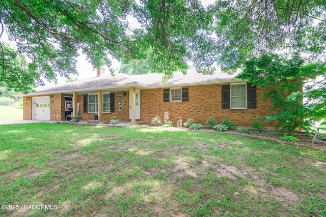 3609 Shamrock Rd, Jefferson City, MO 65101 - single story home featuring a garage, a front yard, brick siding, a chimney, and covered porch