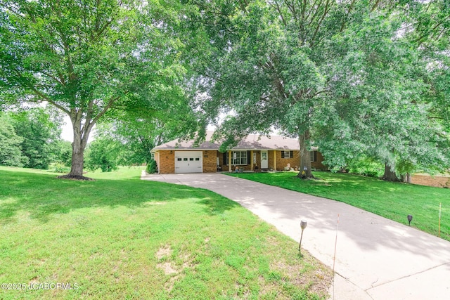 3609 Shamrock Rd, Jefferson City, MO 65101 - single story home featuring concrete driveway, a garage, a front yard, and brick siding