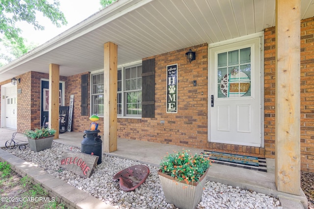3609 Shamrock Rd, Jefferson City, MO 65101 - view of exterior entry featuring a porch and brick siding
