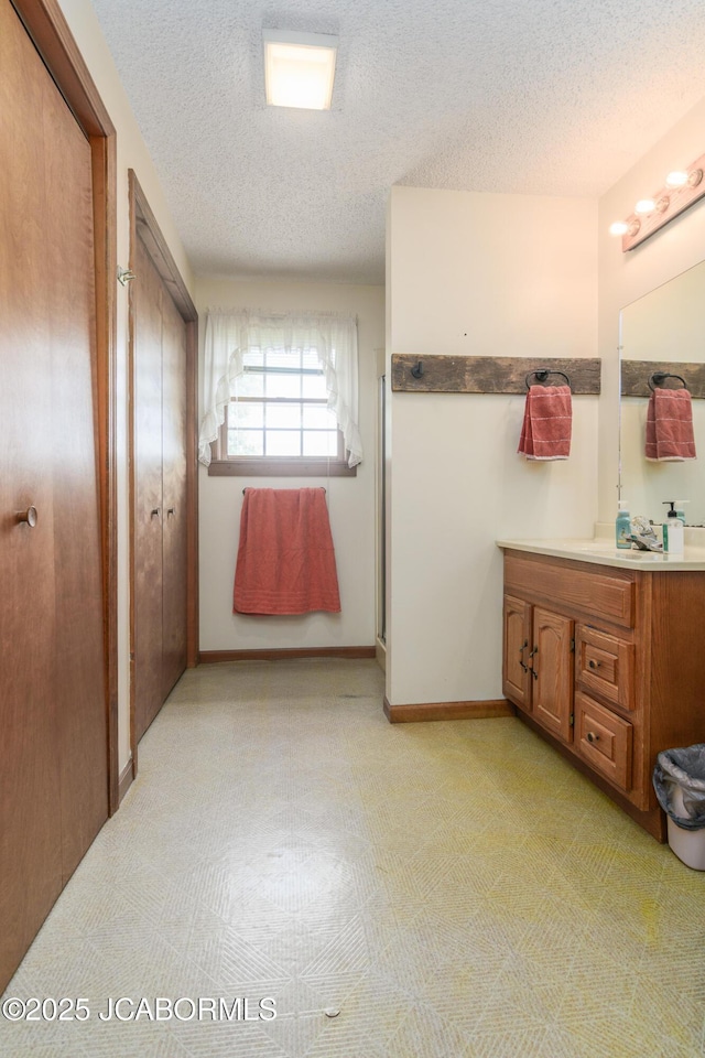 3609 Shamrock Rd, Jefferson City, MO 65101 - bathroom with vanity and a textured ceiling
