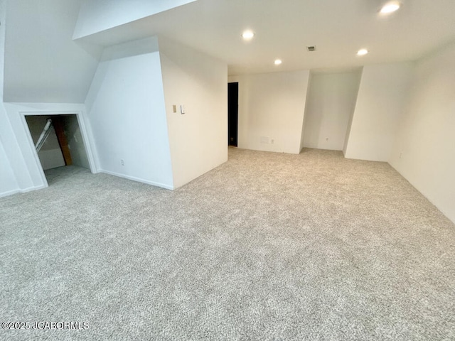 spare room featuring light colored carpet