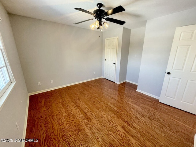 unfurnished bedroom with ceiling fan and hardwood / wood-style floors