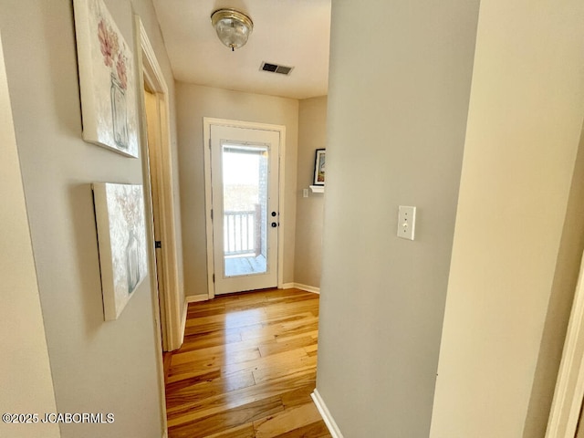 entryway with light hardwood / wood-style flooring