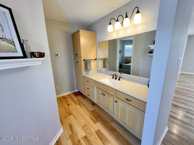 bathroom with vanity and wood-type flooring
