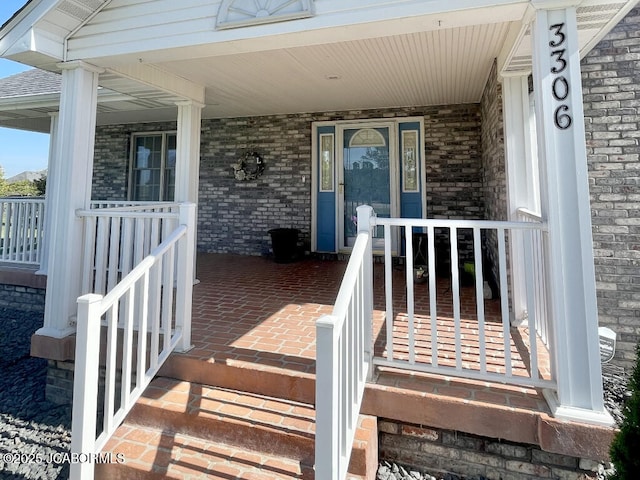 doorway to property featuring a porch
