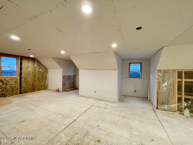 bonus room featuring vaulted ceiling