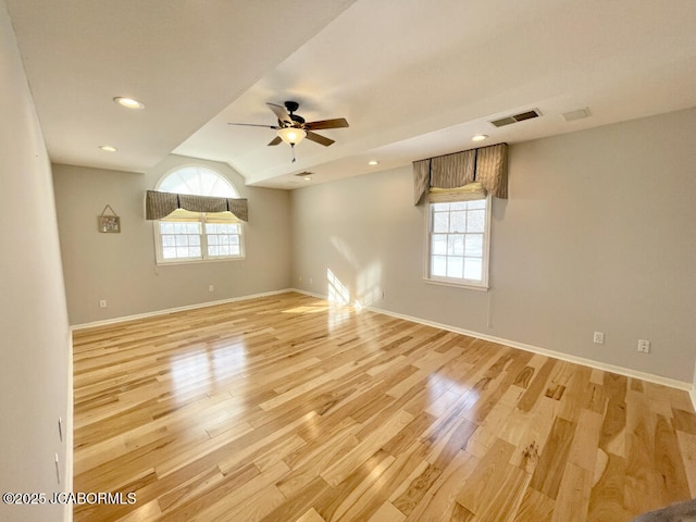 spare room with ceiling fan and light hardwood / wood-style flooring