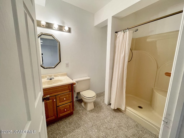 bathroom featuring vanity, toilet, and a shower with shower curtain