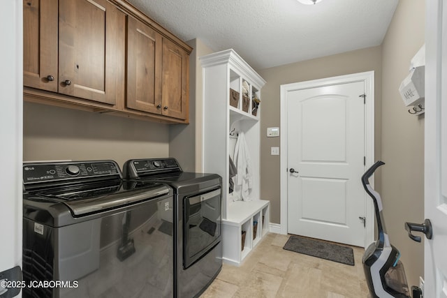 laundry area featuring cabinet space and washing machine and dryer