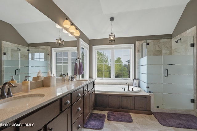 bathroom featuring a sink, a shower stall, and lofted ceiling