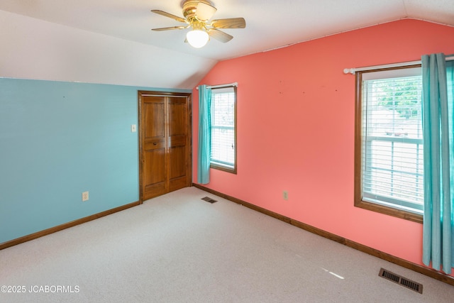7515 Rte M, Jefferson City, MO 65101 - empty room with vaulted ceiling, baseboards, carpet floors, and ceiling fan