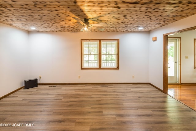 7515 Rte M, Jefferson City, MO 65101 - spare room with healthy amount of natural light, ceiling fan, wood finished floors, baseboards, and recessed lighting