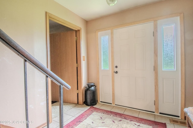 3674 State Rd, Aa, Holts Summit, MO 65043 - foyer featuring light tile patterned floors and stairs