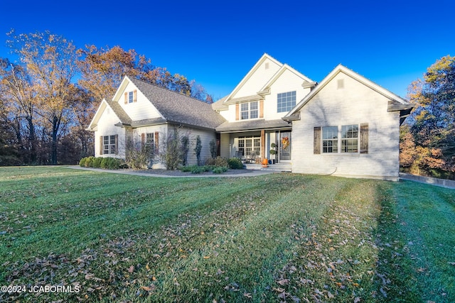 view of property featuring a front lawn