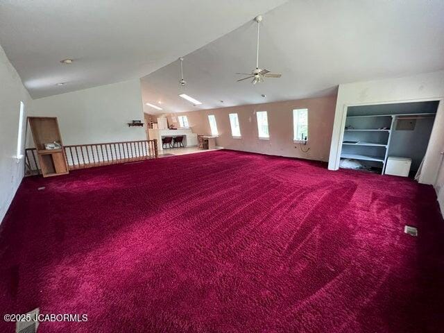 bonus room with lofted ceiling, carpet, and a ceiling fan
