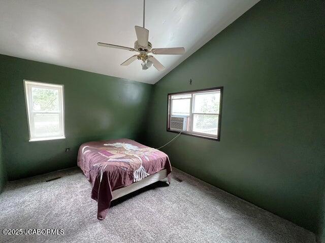 5888 State Rd E, Auxvasse, MO 65231 - bedroom with lofted ceiling, multiple windows, carpet flooring, and cooling unit