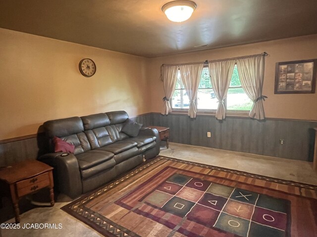 5888 State Rd E, Auxvasse, MO 65231 - carpeted living room featuring a wainscoted wall and wooden walls