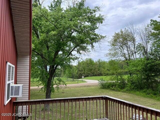 deck featuring a lawn