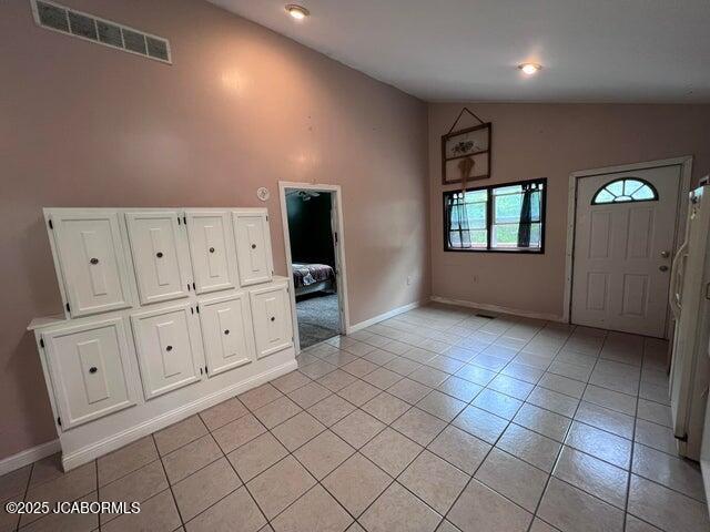 5888 State Rd E, Auxvasse, MO 65231 - entrance foyer with light tile patterned flooring, high vaulted ceiling, and recessed lighting