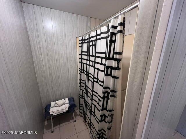 bathroom view of wood walls