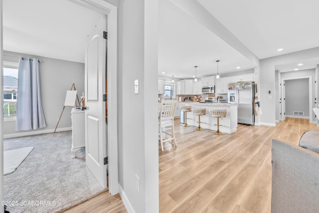 15250 General Dr, Ashland, MO 65010 - living room featuring visible vents, light wood-type flooring, recessed lighting, and baseboards