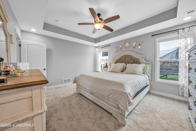 15250 General Dr, Ashland, MO 65010 - bedroom featuring baseboards, visible vents, light carpet, and a tray ceiling