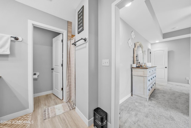 15250 General Dr, Ashland, MO 65010 - full bath featuring a shower with shower curtain, wood finished floors, vanity, and baseboards
