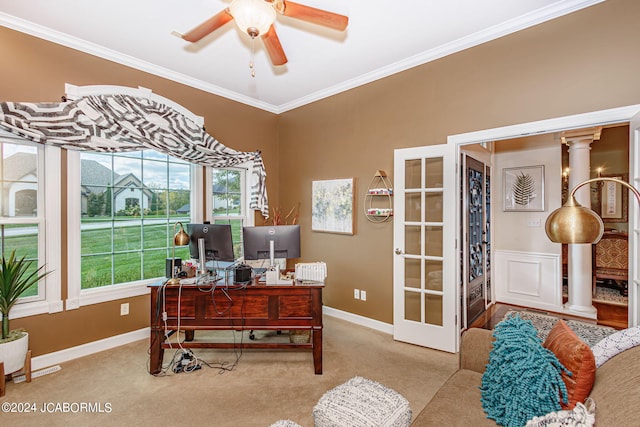 office area with ornate columns, crown molding, and light colored carpet