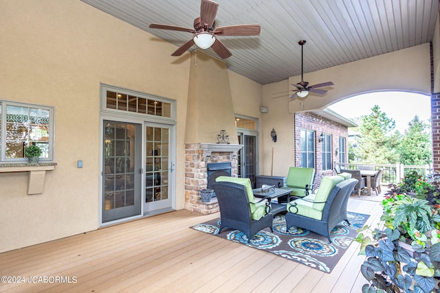 wooden deck featuring ceiling fan