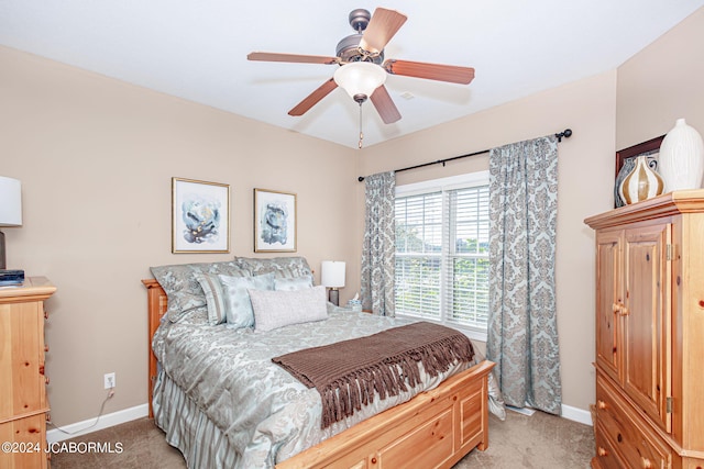 bedroom featuring ceiling fan and light colored carpet