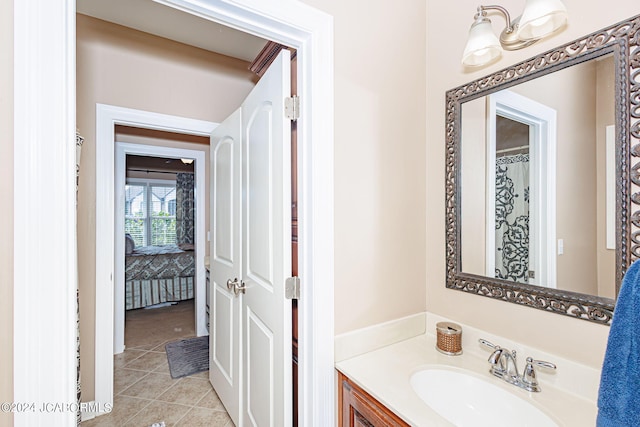 bathroom with tile patterned flooring and vanity