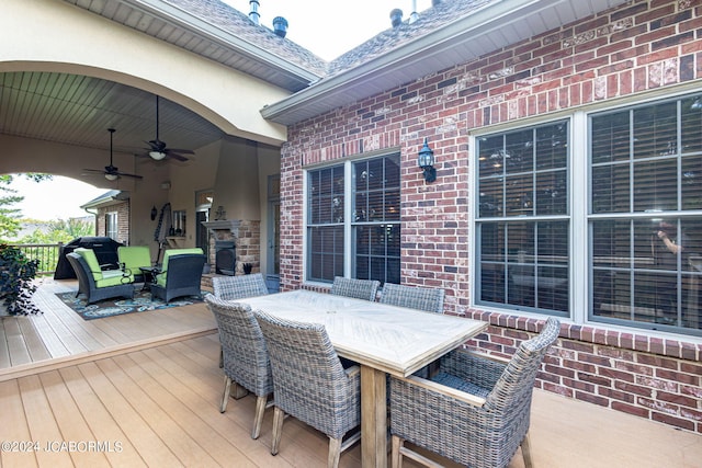 wooden deck featuring ceiling fan