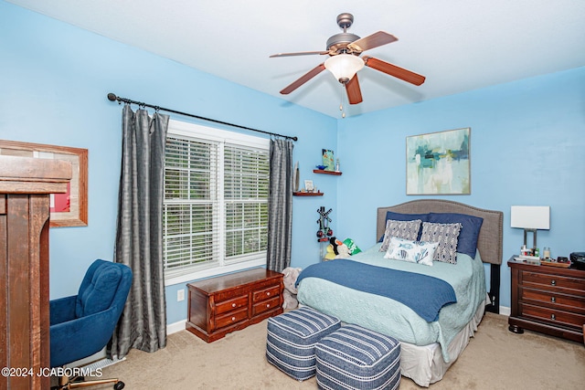 bedroom with light carpet and ceiling fan