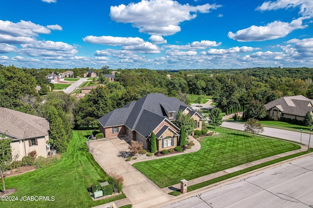 bird's eye view featuring a forest view