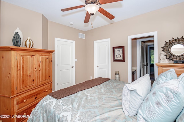 bedroom featuring ensuite bath and ceiling fan