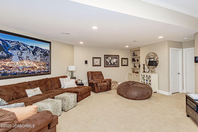 living room with light carpet, built in shelves, and ornamental molding