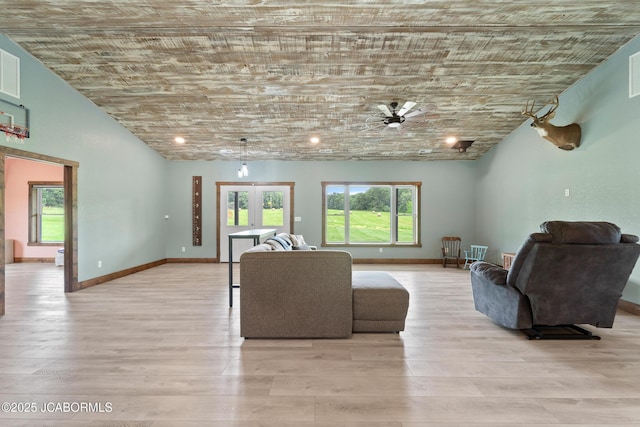 8596 County Rd 146, Williamsburg, MO 63388 - living room featuring light wood-style floors, french doors, a ceiling fan, baseboards, and visible vents