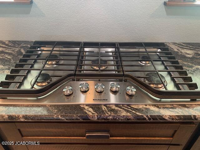 8596 County Rd 146, Williamsburg, MO 63388 - interior details featuring dark countertops and stainless steel gas cooktop