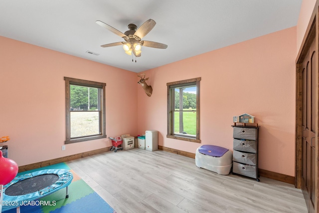 8596 County Rd 146, Williamsburg, MO 63388 - playroom with baseboards, visible vents, and light wood-type flooring
