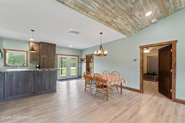 8596 County Rd 146, Williamsburg, MO 63388 - dining space featuring french doors, baseboards, a healthy amount of sunlight, and light wood-type flooring