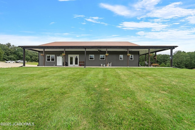 8596 County Rd 146, Williamsburg, MO 63388 - back of house with a yard, french doors, and metal roof