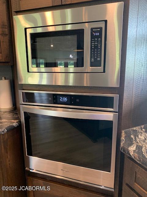 8596 County Rd 146, Williamsburg, MO 63388 - interior details with dark brown cabinetry, dark countertops, and stainless steel appliances