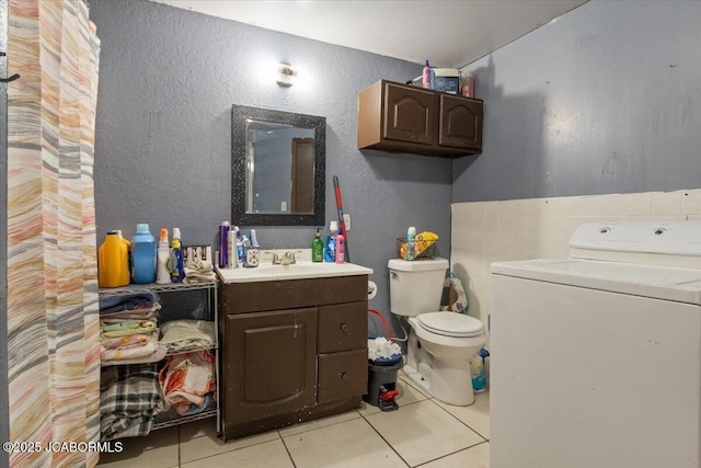 97 Stoddard Rd, Olean, MO 65064 - bathroom featuring washer / dryer, tile patterned floors, and vanity