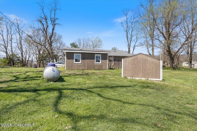 97 Stoddard Rd, Olean, MO 65064 - back of house featuring a yard and a storage shed