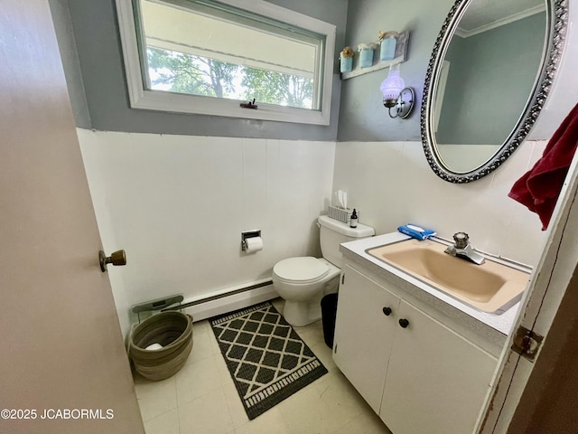 501 W Morgan St, Tipton, MO 65081 - bathroom featuring a baseboard radiator, vanity, and tile patterned flooring