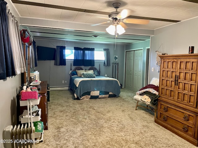 501 W Morgan St, Tipton, MO 65081 - bedroom featuring a baseboard heating unit, carpet, a closet, ornamental molding, and ceiling fan